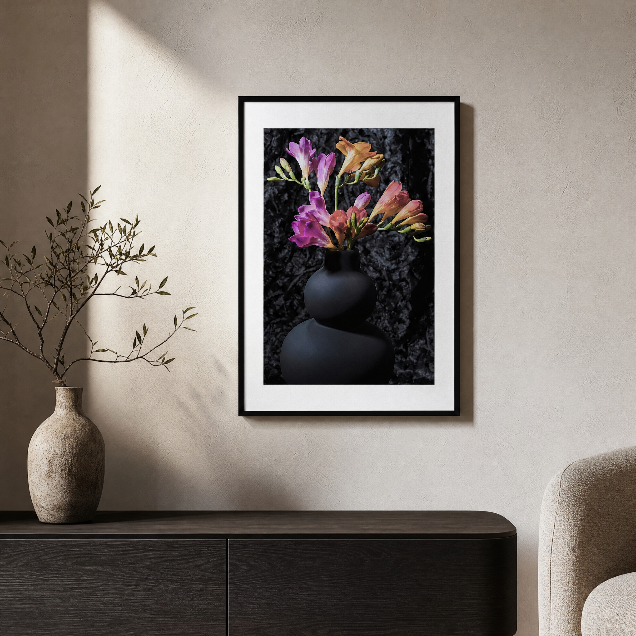 Framed artwork of flowers on a wall above a dark wooden cabinet with a vase and branches. ~ Fine Art Photograpphy by Ivo Titzin ~ Luxury Wall Art by Gito