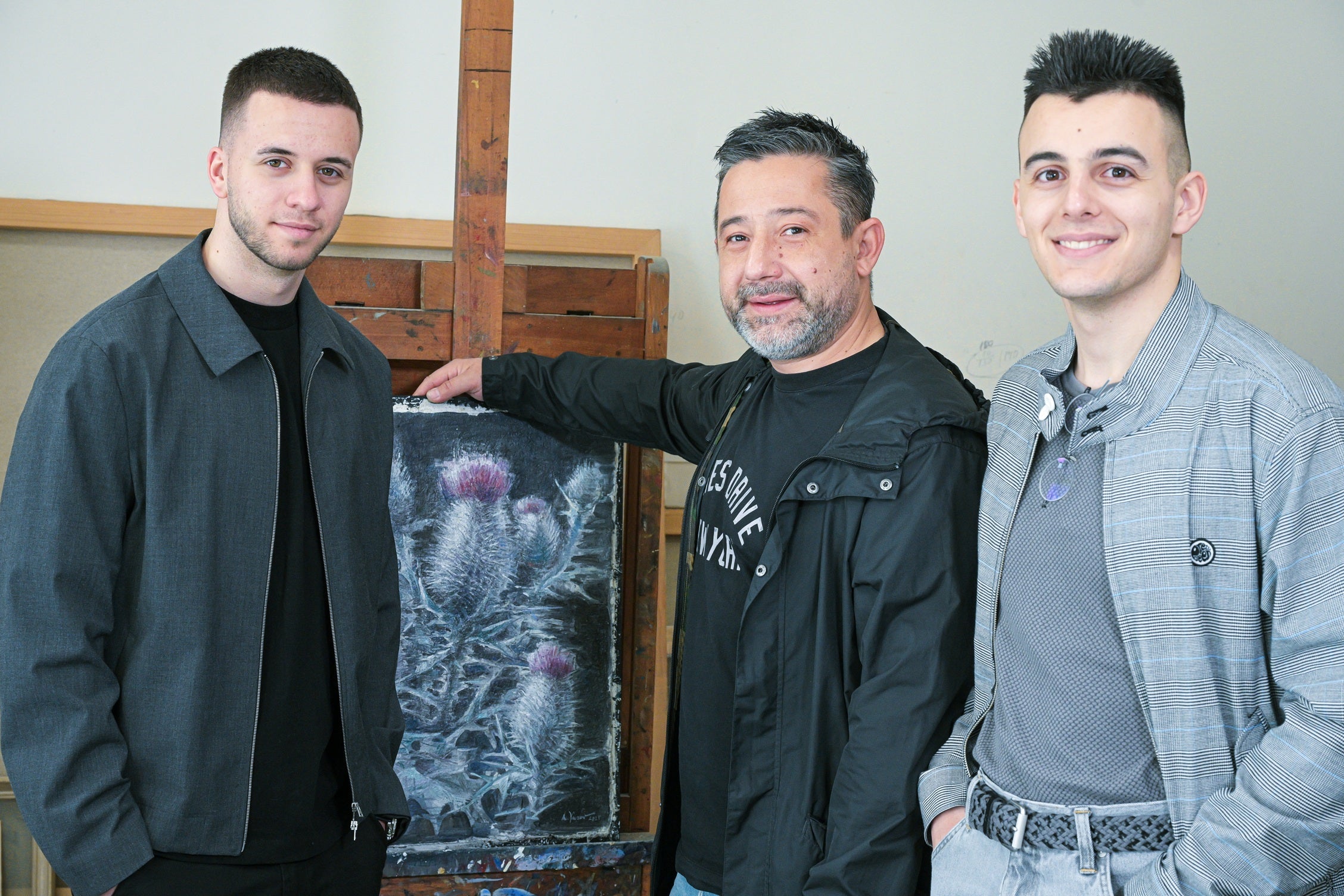 Founders Of Gito Art Posing in front of the emblematic Thistle
