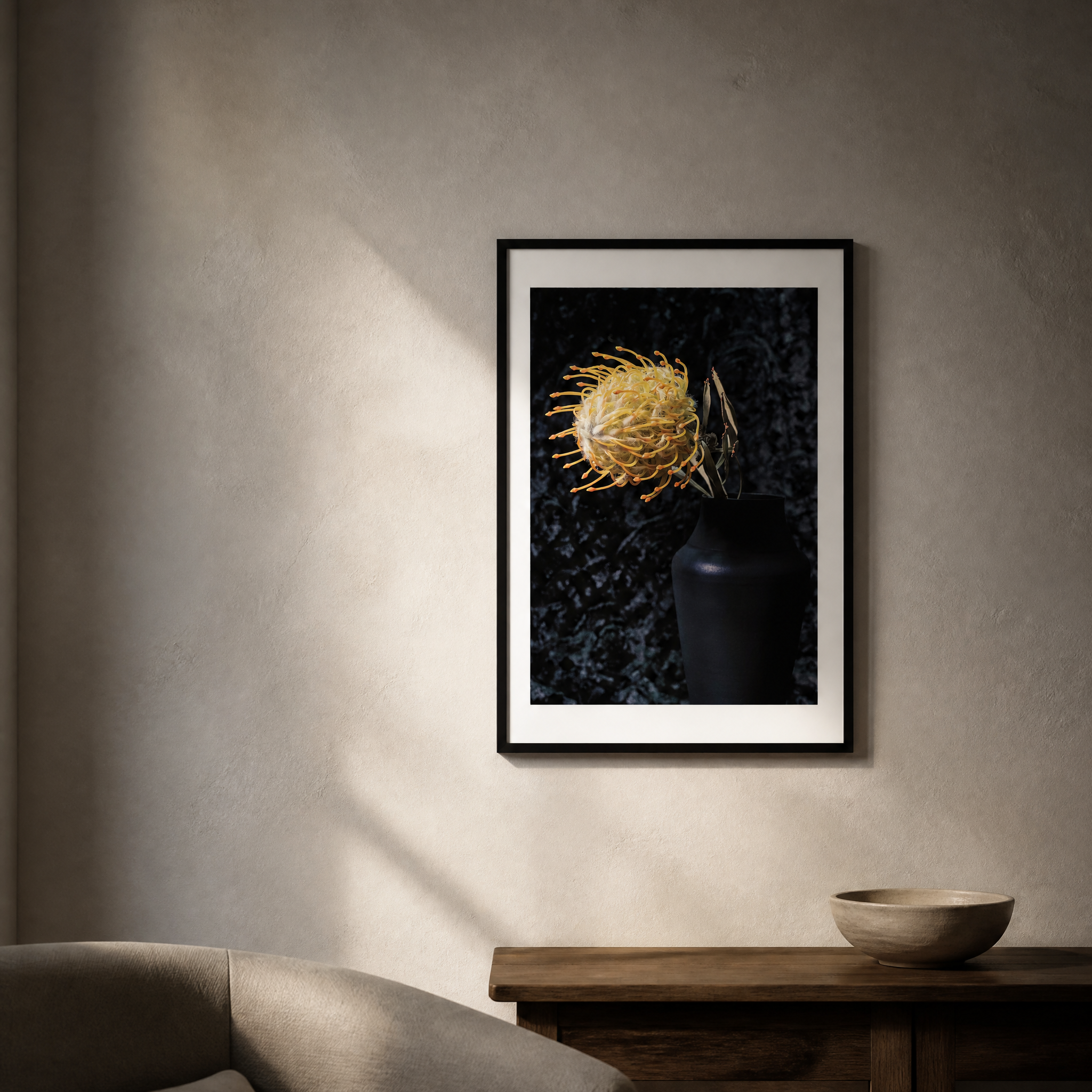 Framed artwork of a yellow flower in a dark vase on a textured wall. ~ Pincushion Protea ~ Fine Art Photography by Ivo Titzin ~ Luxury Wall Art by Gito ~ Limited edition