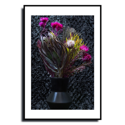 Framed artwork of a floral arrangement with pink flowers and green leaves on a textured black background ~ Fine Art Photography by Ivo Titzin ~ Luxury Wall Art by Gito Art  