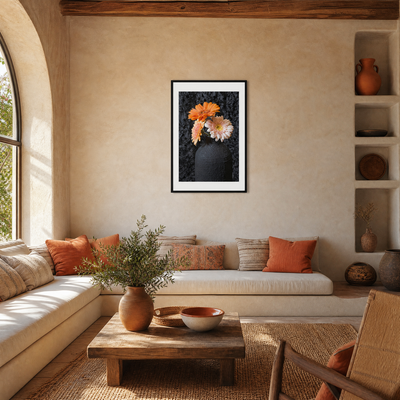 Living room with a framed floral picture on the wall, beige sofa with orange pillows, wooden coffee table, and decorative items.  ~ Fine Art Photography by Ivo Titzin ~ Gito Luxury Wall Art 