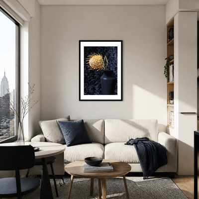 Modern living room with a white sofa, coffee table, and framed artwork on the wall. ~ Pincushion Protea ~ Fine Art Photography by Ivo Titzin ~ Luxury Wall Art by Gito ~ Limited edition