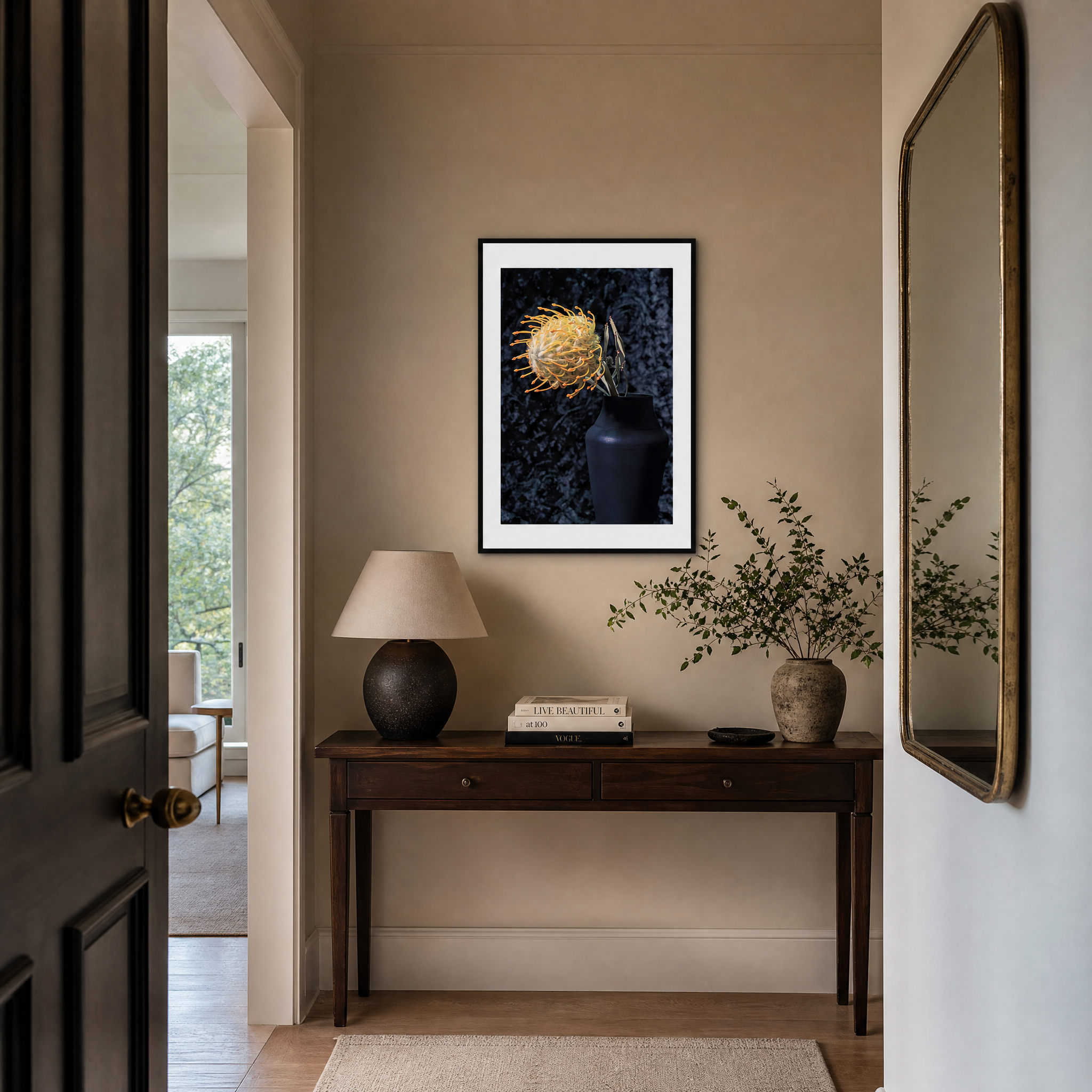Narrow hallway with a dark wooden console table, lamp, books, and decorative items. ~ Pincushion Protea ~ Fine Art Photography by Ivo Titzin ~ Luxury Wall Art by Gito ~ Limited edition