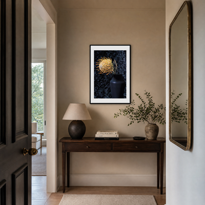 Narrow hallway with a dark wooden console table, lamp, books, and decorative items. ~ Pincushion Protea ~ Fine Art Photography by Ivo Titzin ~ Luxury Wall Art by Gito ~ Limited edition