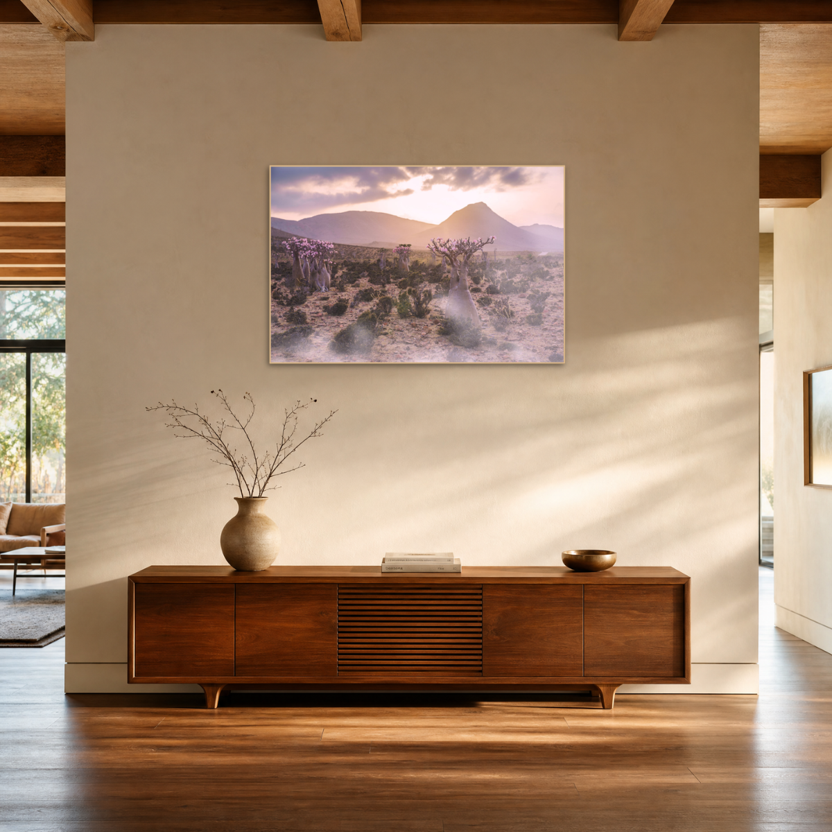 Gito.Art - Exclusive Art Print - Photography by Delyan Markov
A framed landscape art print depicting a desert mountain scene at sunset, displayed on a beige wall above a wooden console table in a modern, sunlit room.