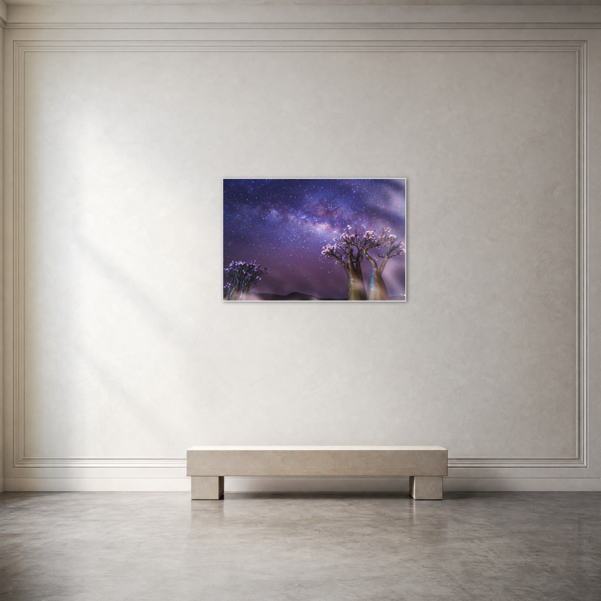 Gito.Art - Exclusive Art Print - Photography by Delyan Markov
A framed wall art print depicting a purple and blue night sky with two flowering trees, displayed on a light beige wall above a minimalist bench in a modern room setting.