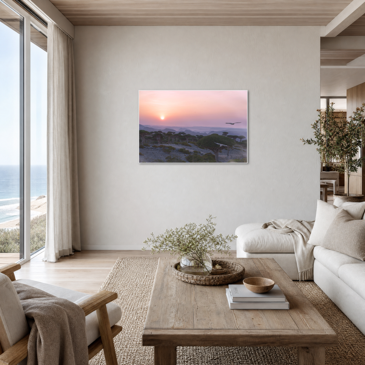 Gito.Art - Exclusive Art Print - Photography by Delyan Markov
A framed landscape art print of a beach sunset hangs on a light beige wall in a modern, sunlit living room with a wooden coffee table, white sofa, and ocean view.
