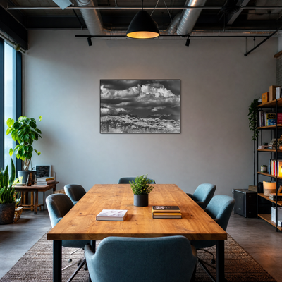 Gito.Art - Exclusive Art Print - Photography by Delyan Markov
A black and white landscape art print depicting snowy mountains under a cloudy sky, displayed on a gray wall in a modern office setting with a wooden conference table and blue chairs.