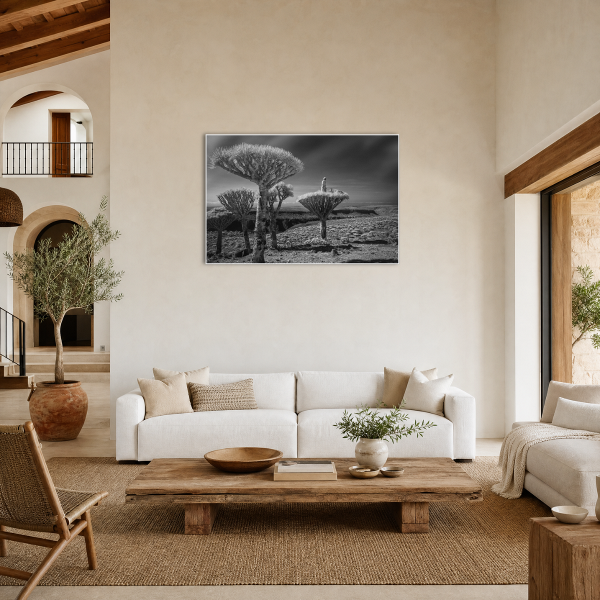 Gito.Art - Exclusive Art Print - Photography by Delyan Markov
A black and white landscape art print featuring quiver trees in a field, displayed on a beige wall in a modern, neutral-toned living room with a white sofa and wooden coffee table.