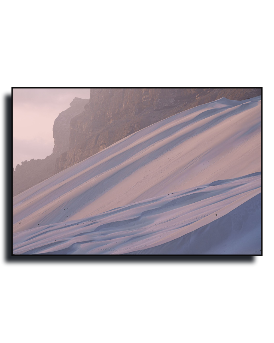 Gito.Art - Exclusive Art Print - Photography by Delyan Markov
A framed landscape art print depicting a snowy mountain slope under a soft pinkish sky, shown against a plain white background.