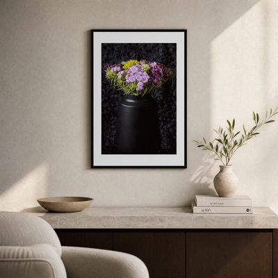 Framed artwork of flowers on a wall above a table with decor items.  ~ Fine Art Photography by Ivo Titzin ~ Gito Limited Wall Art 