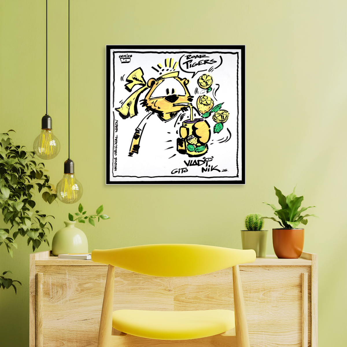 Gito Fine Art Print - Art Vladi Vl Comics - Tigers
A framed black and white cartoon art print featuring a yellow cat wearing a tiara and holding flowers, hanging on a light green wall above a wooden console table with a yellow chair and small potted plants.